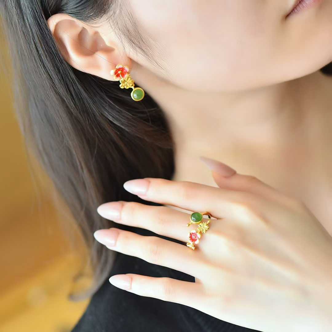 Luxury Hetian jade and sterling silver jewelry set featuring cabochon stones and blooming plum flowers