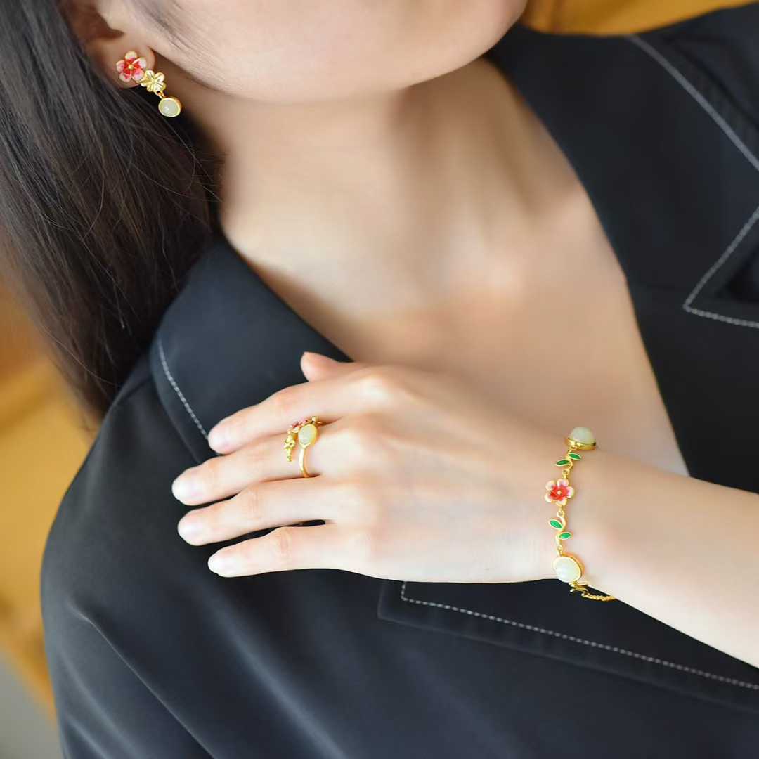 Luxury minimalist Hetian nephrite jewelry set featuring traditional Chinese peach flowers design