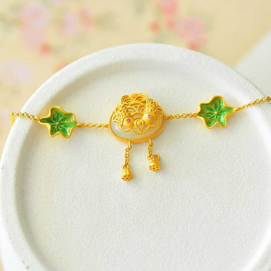 Close-up of lotus and fish carving on Hetian jade bracelet - traditional symbol