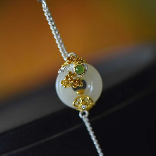 Close-up of osmanthus flower design Hetian jade pendant from Twelve Flower Gods series"