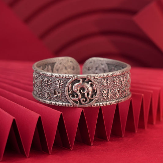 Close-up of blessing pattern engraving on sterling silver bracelet