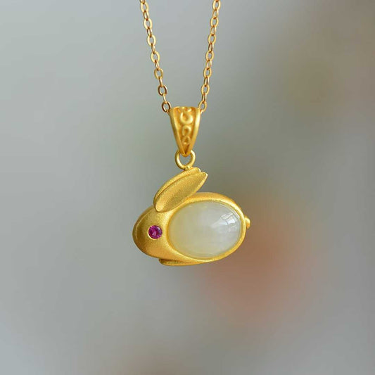 Close-up of cute rabbit design Hetian jade pendant in vintage silver with matte gold coating"