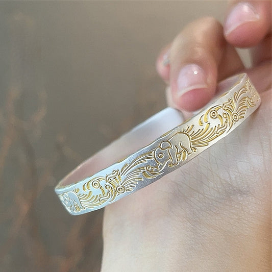 Solid bracelet with gold - painted lucky elephant and hammered pattern - jewelry - weilin.com