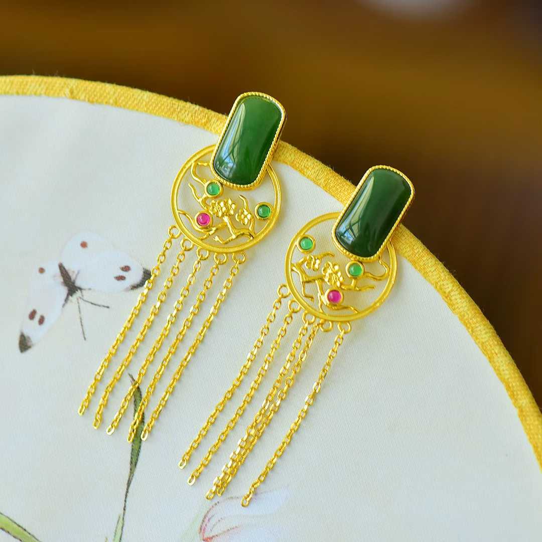Close-up of plum blossom carving on Hetian jasper - traditional Chinese earrings
