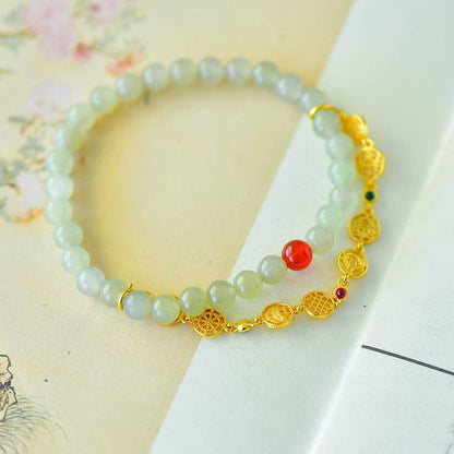Detailed eight treasures chain on Hetian jade bracelet
