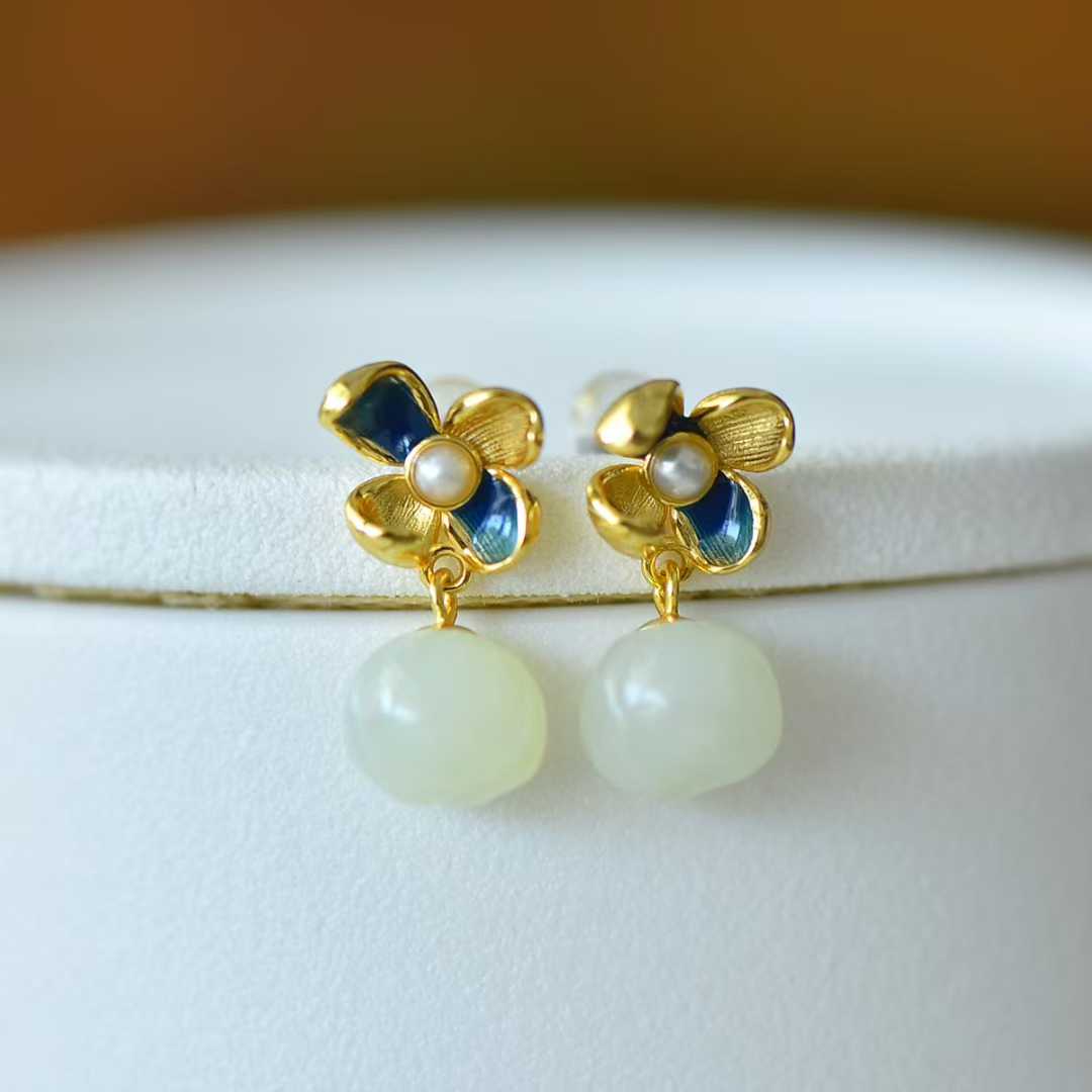 Detailed view of traditional lotus and annual auspiciousness design on Hetian nephrite jewelry"