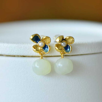 Detailed view of traditional lotus and annual auspiciousness design on Hetian nephrite jewelry"