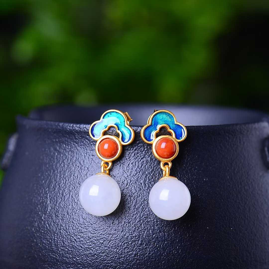 Close-up of 8mm white Hetian jade beads with colorful enamel accents in sterling silver