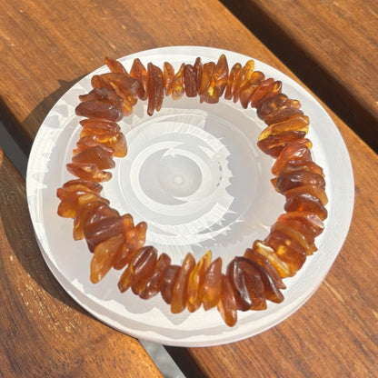 Sea drifting rough stone with the shape of the bracelet