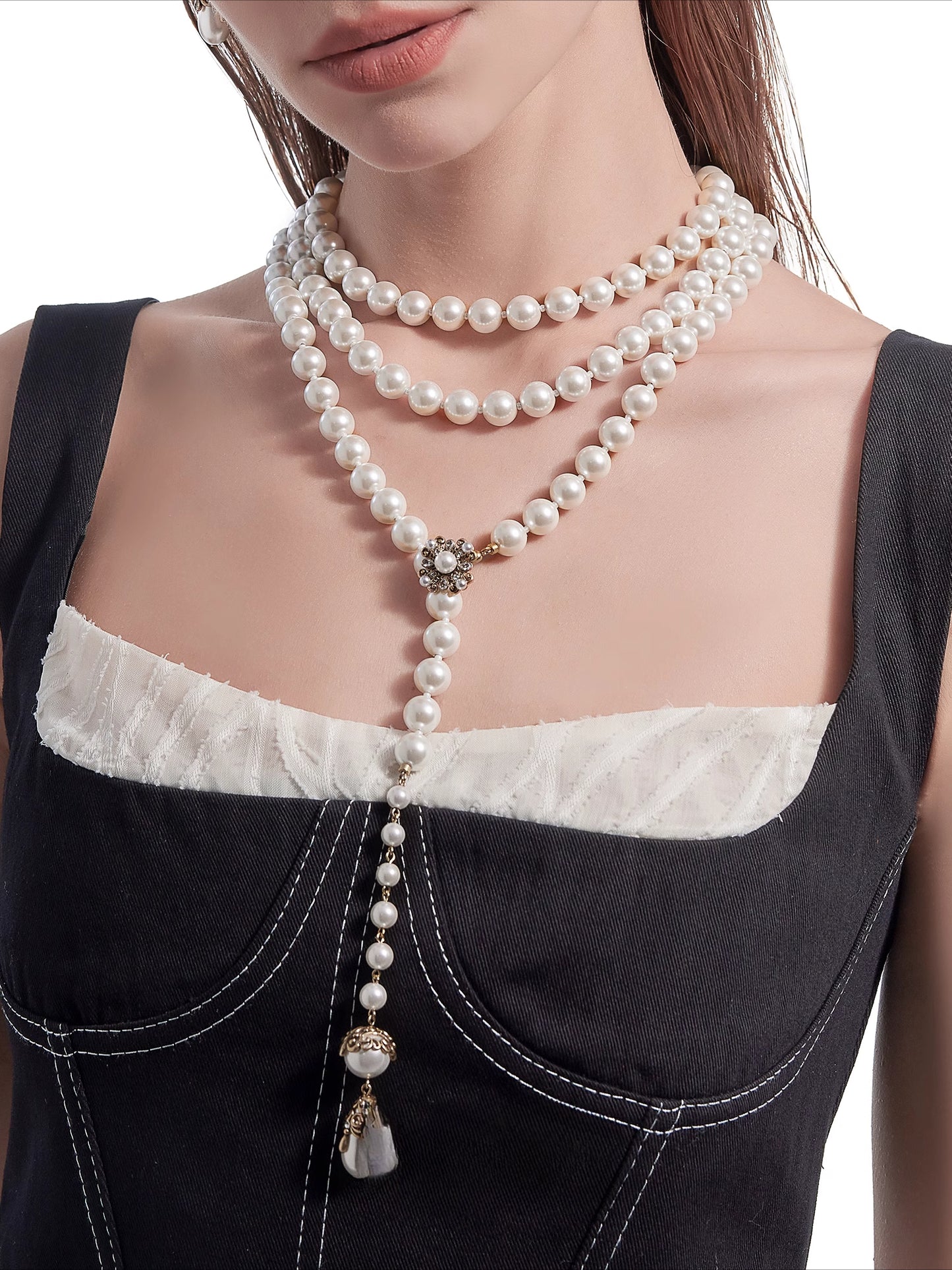 Long pearl necklace with multiple layers