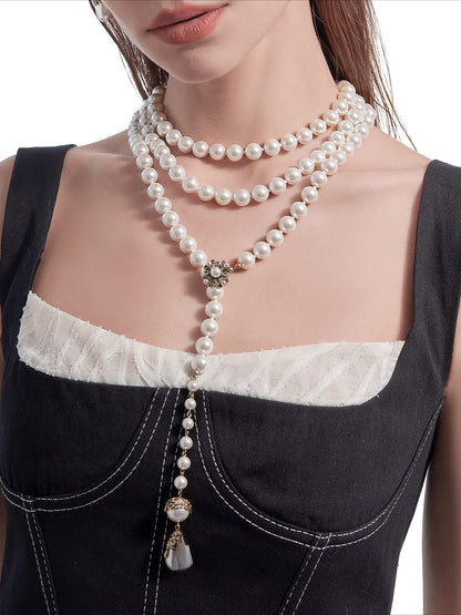 Long pearl necklace with multiple layers