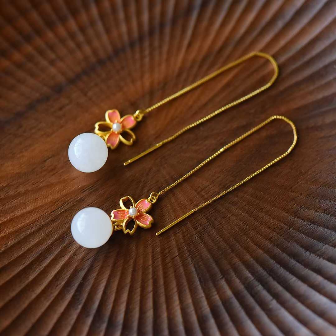  Detailed view of delicate floral enamel with translucent white jade beads vintage style