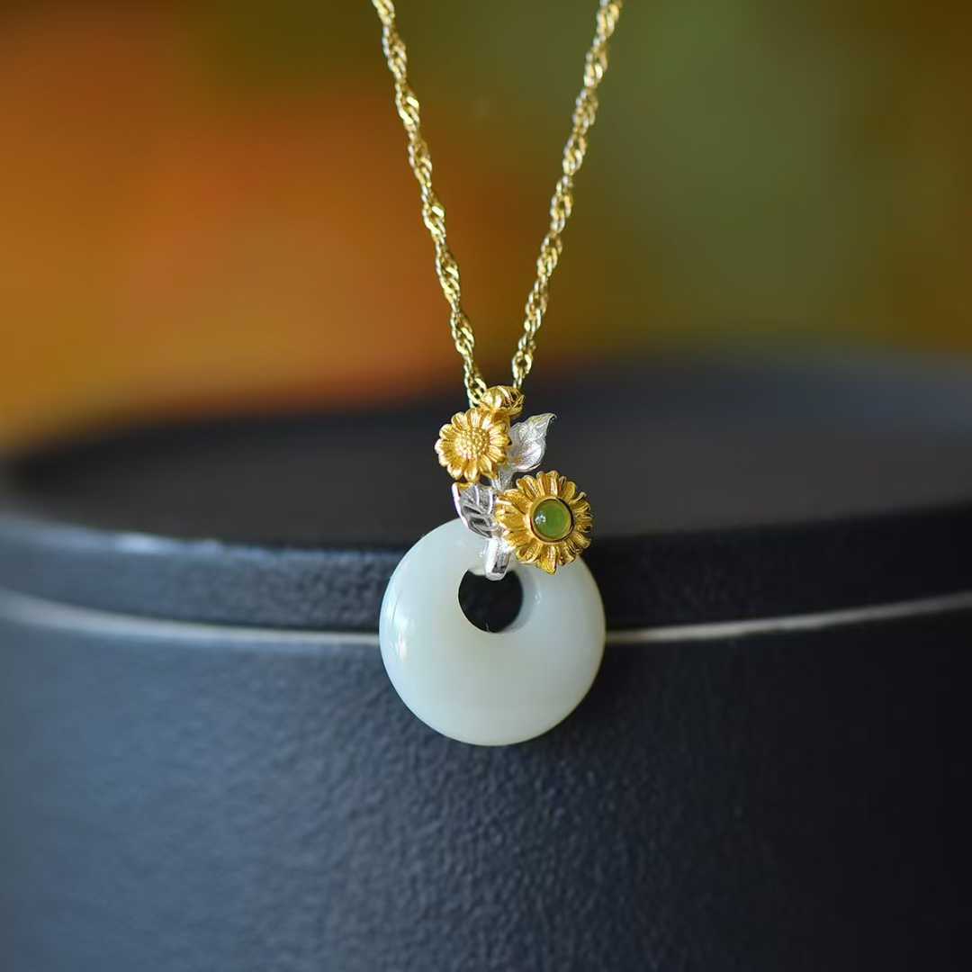 Close-up of hollyhock flower design Hetian jade pendant from Twelve Flower Gods series"