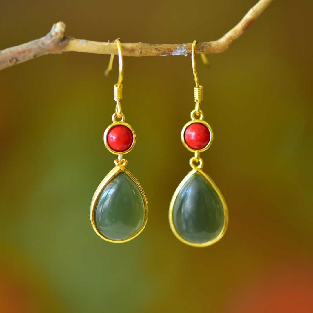 Detailed view of minimalist water drop design on Hetian nephrite and cinnabar jewelry