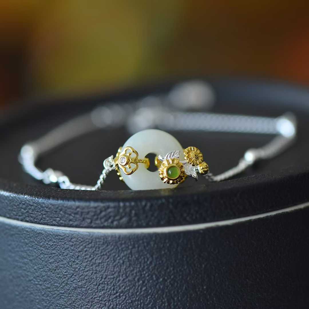 Detailed view of July hollyhock motif on traditional Hetian nephrite jewelry"