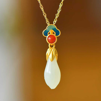  Elegant tassel detail on Hetian nephrite and silver jewelry set featuring traditional Chinese magnolia