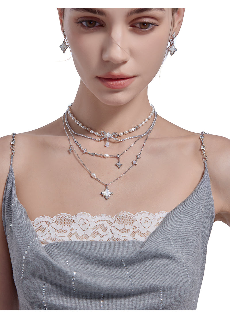 Layered pearl necklace with star pendant