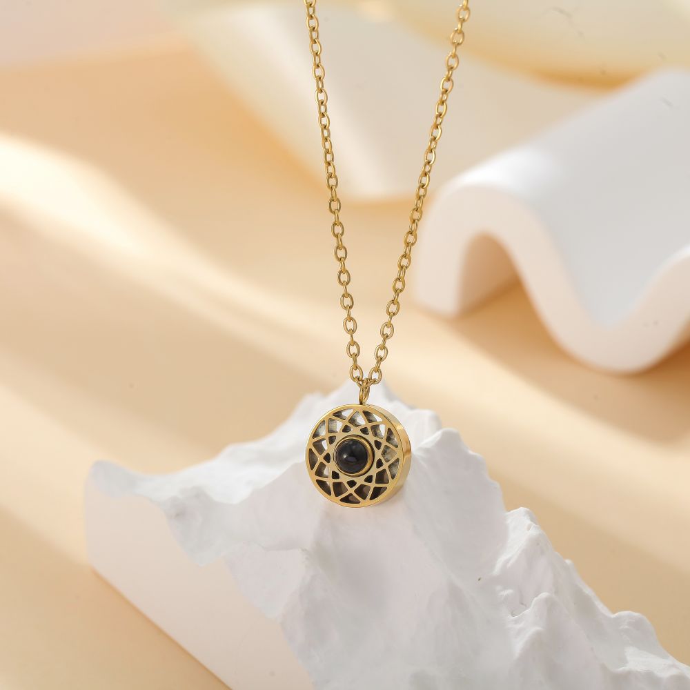 Side view of photo projection couple necklace - hidden photo inside
