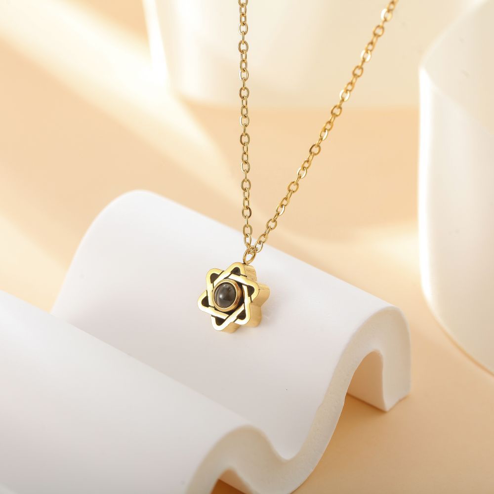 Side view of photo projection star necklace - hidden photo inside
