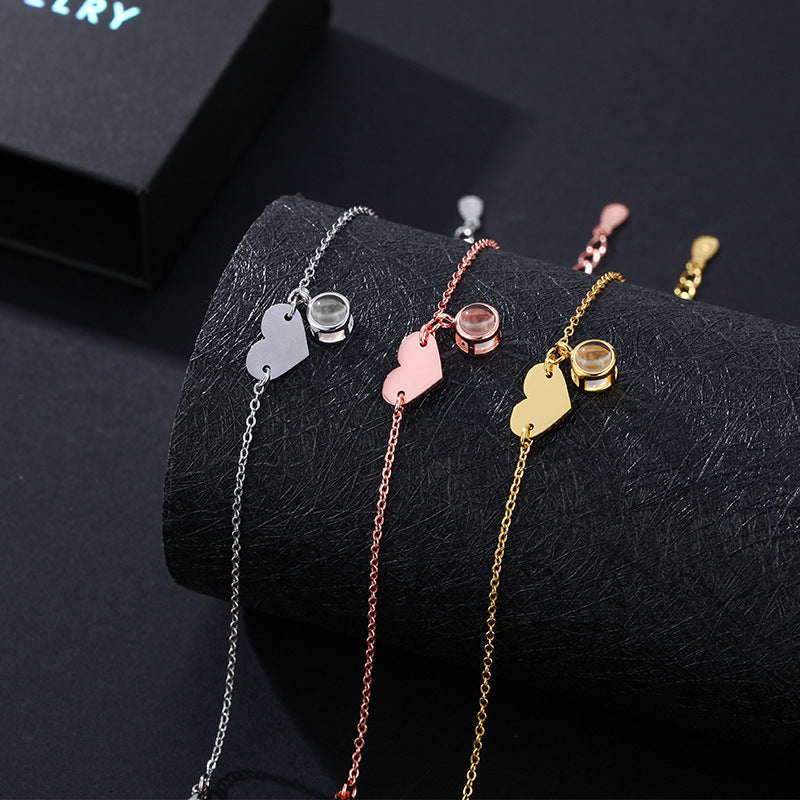 Heart-shaped engraved language projection bracelet