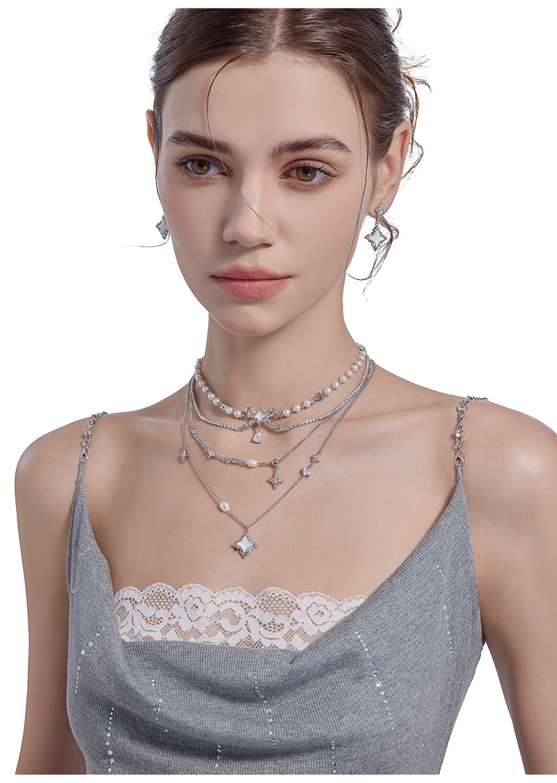 Layered pearl necklace with star pendant