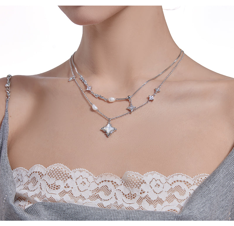 Layered pearl necklace with star pendant