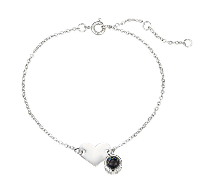 Heart-shaped engraved language projection bracelet
