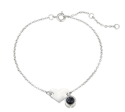 Heart-shaped engraved language projection bracelet