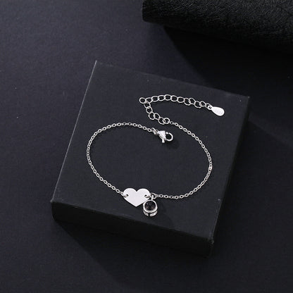 Heart-shaped engraved language projection bracelet