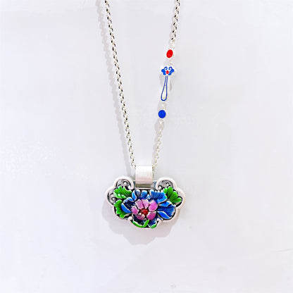 Close-up of carved peace lock design on Chinese style pendant
