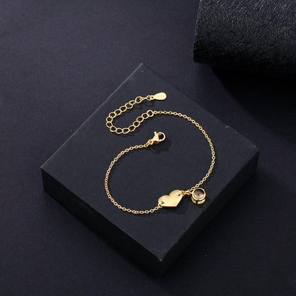 Heart-shaped engraved language projection bracelet