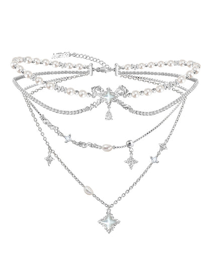 Layered pearl necklace with star pendant