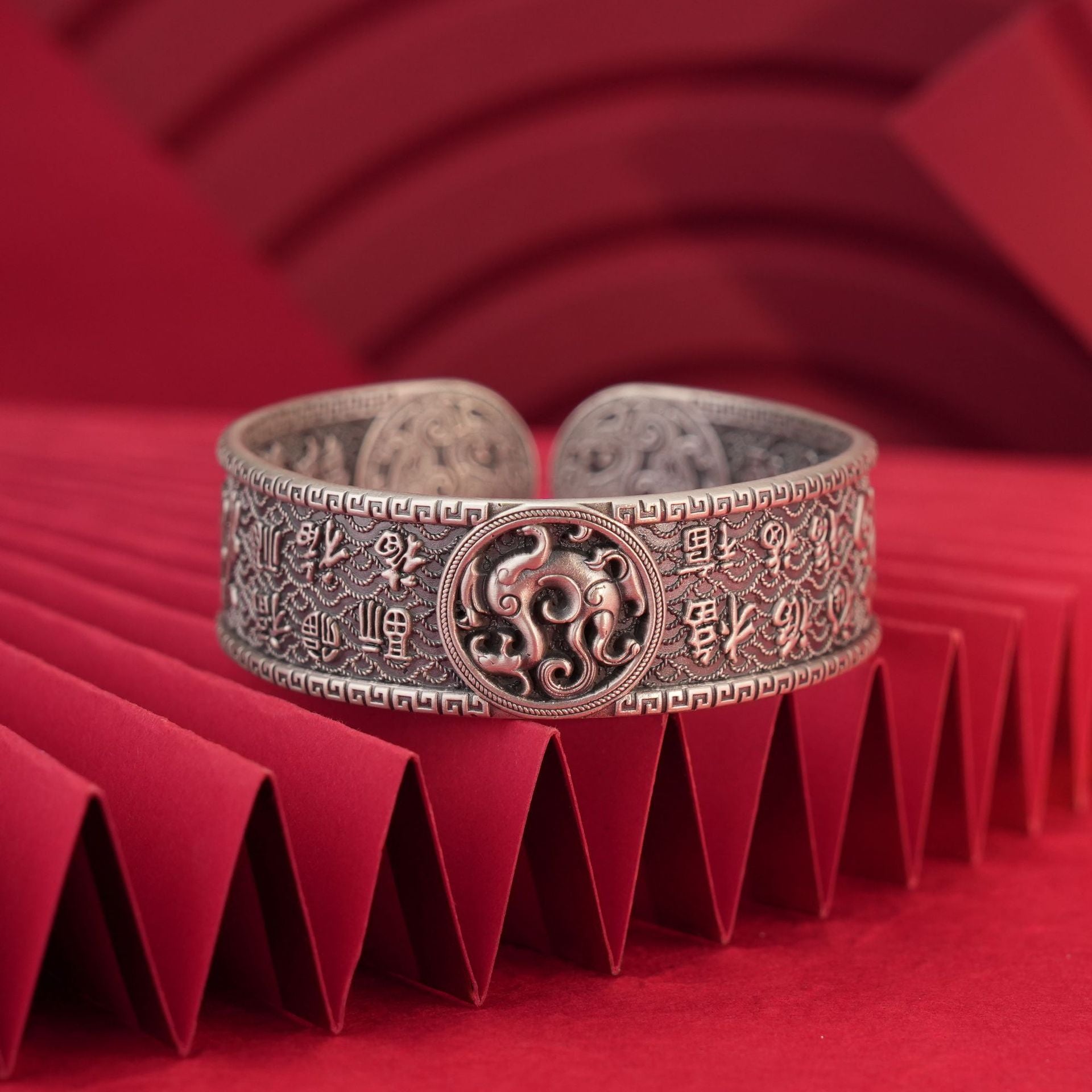 Close-up of blessing pattern engraving on sterling silver bracelet
