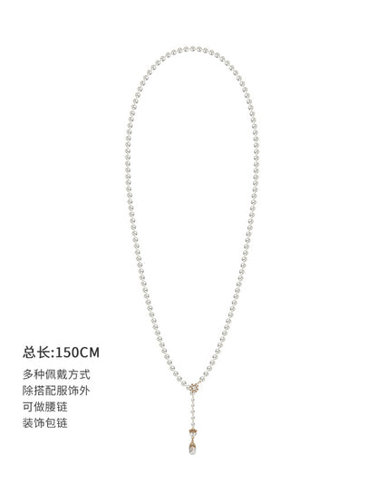Long pearl necklace with multiple layers