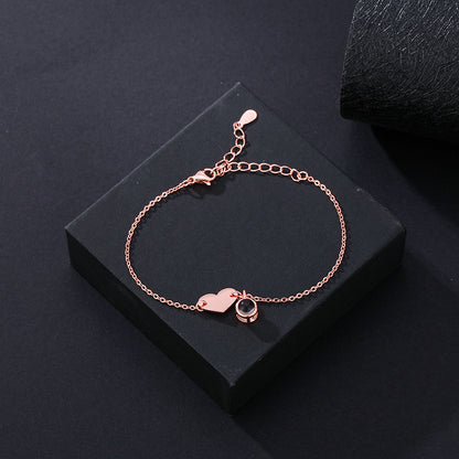 Heart-shaped engraved language projection bracelet