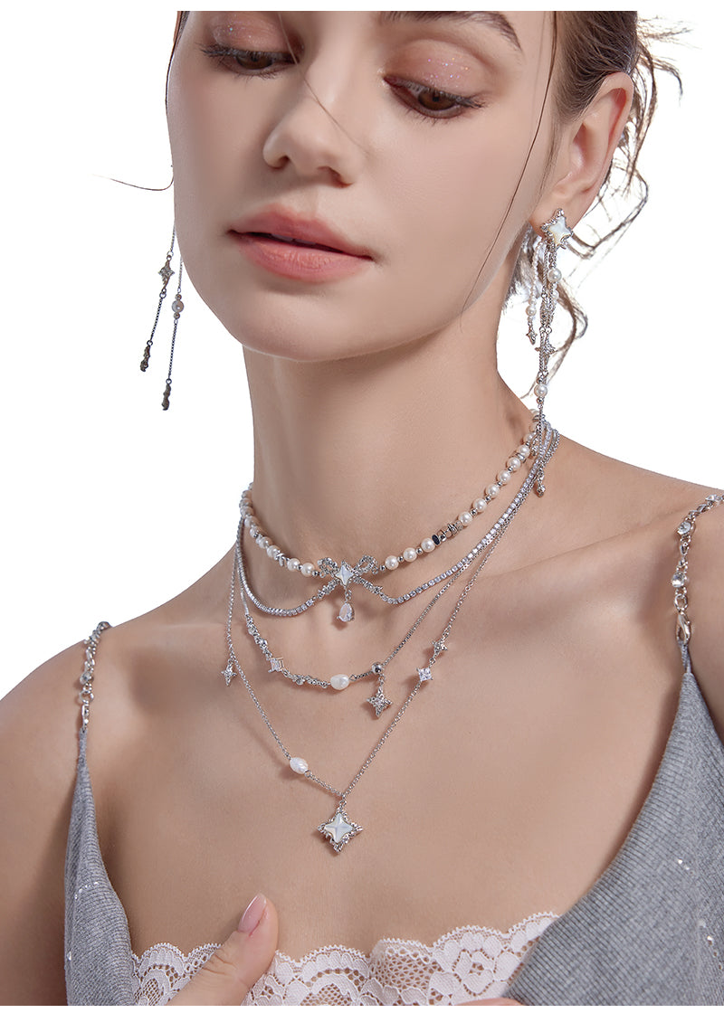 Layered pearl necklace with star pendant