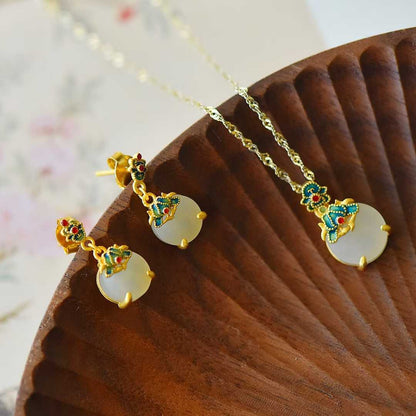 Elegant vintage silver inlaid Hetian jade set featuring flat orchid pattern