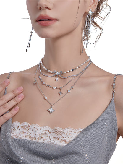 Layered pearl necklace with star pendant