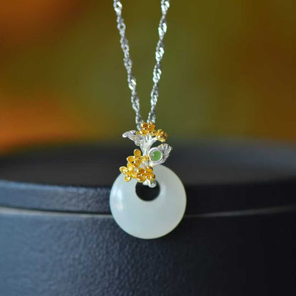 Detailed view of August osmanthus motif on traditional Hetian nephrite jewelry