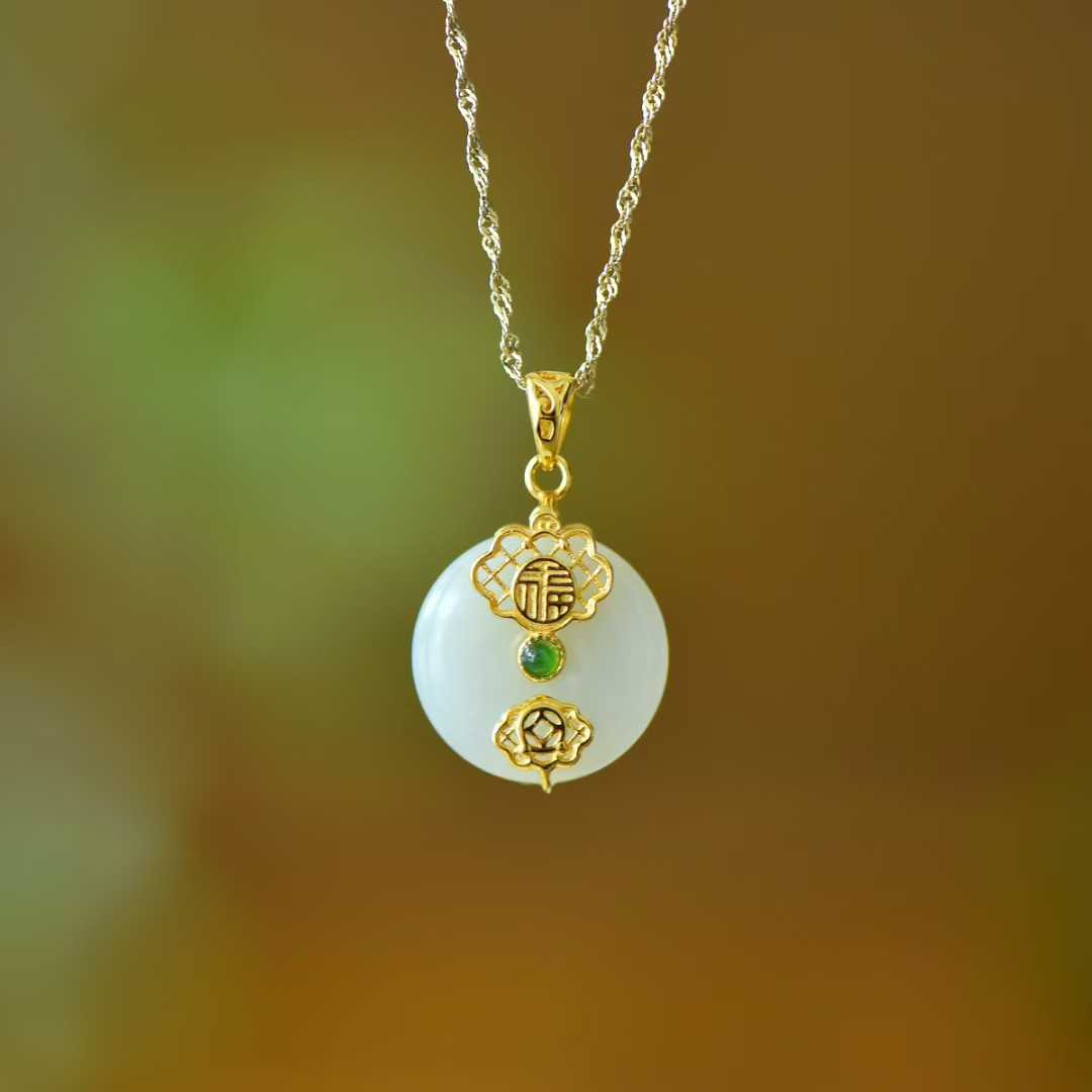 Close-up of Hetian jade Peace and Smoothness pendant in sterling silver setting