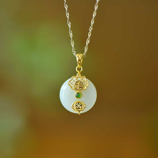 Close-up of Hetian jade Peace and Smoothness pendant in sterling silver setting