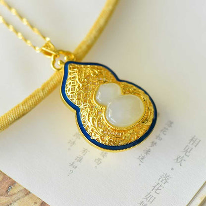 Side view of fortune and emoluments design Hetian nephrite gourd pendant
