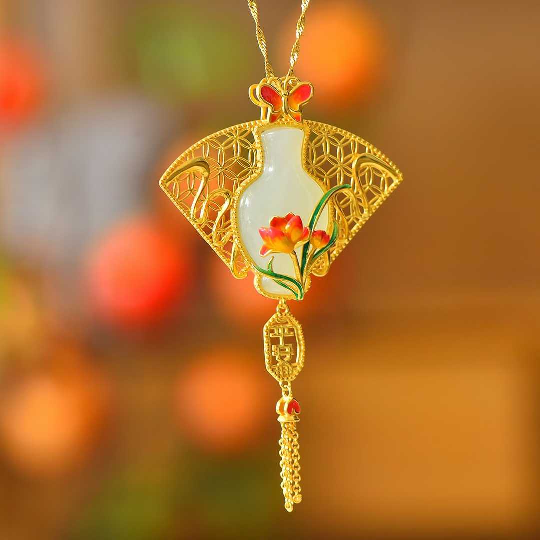 Close-up of white Hetian nephrite peace vase with delicate silver tassel and beads