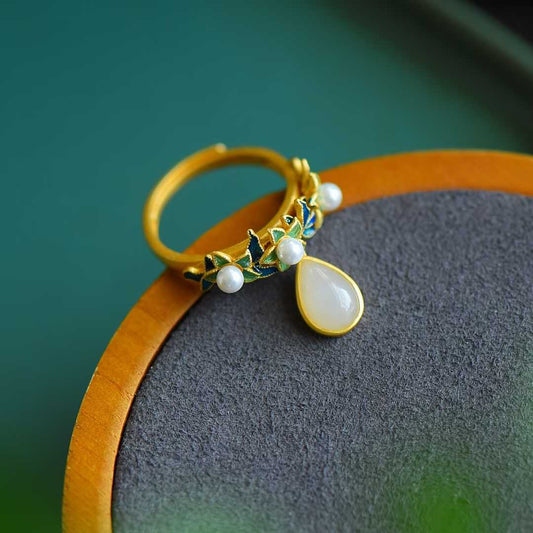 Close-up of smooth nephrite with thick matte gold finish in sterling silver setting