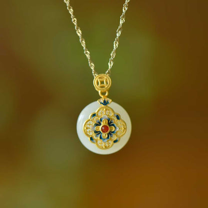 Close-up of Hetian jade peace buckle pendant with blooming flower design in sterling silver"