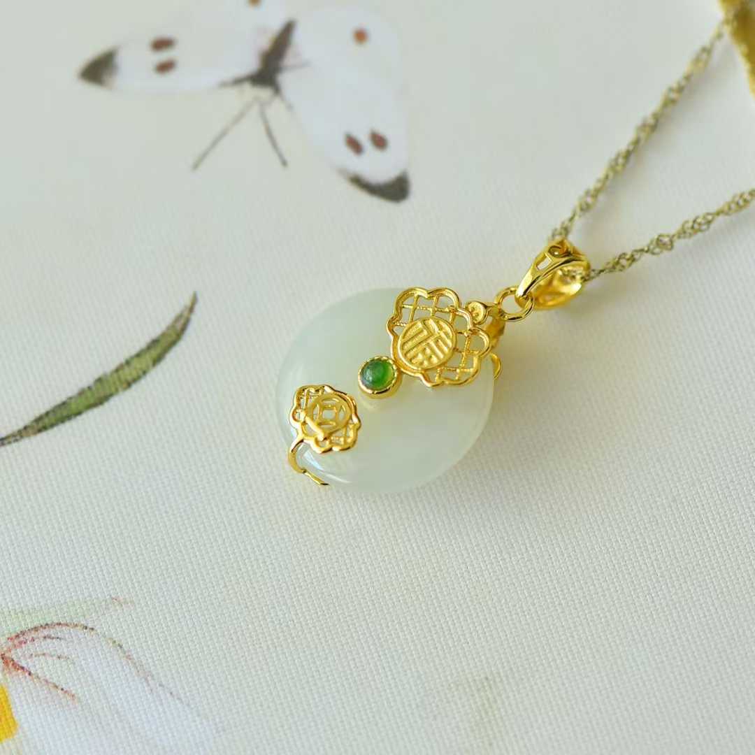 Detailed view of traditional peace symbol on Hetian nephrite jewelry