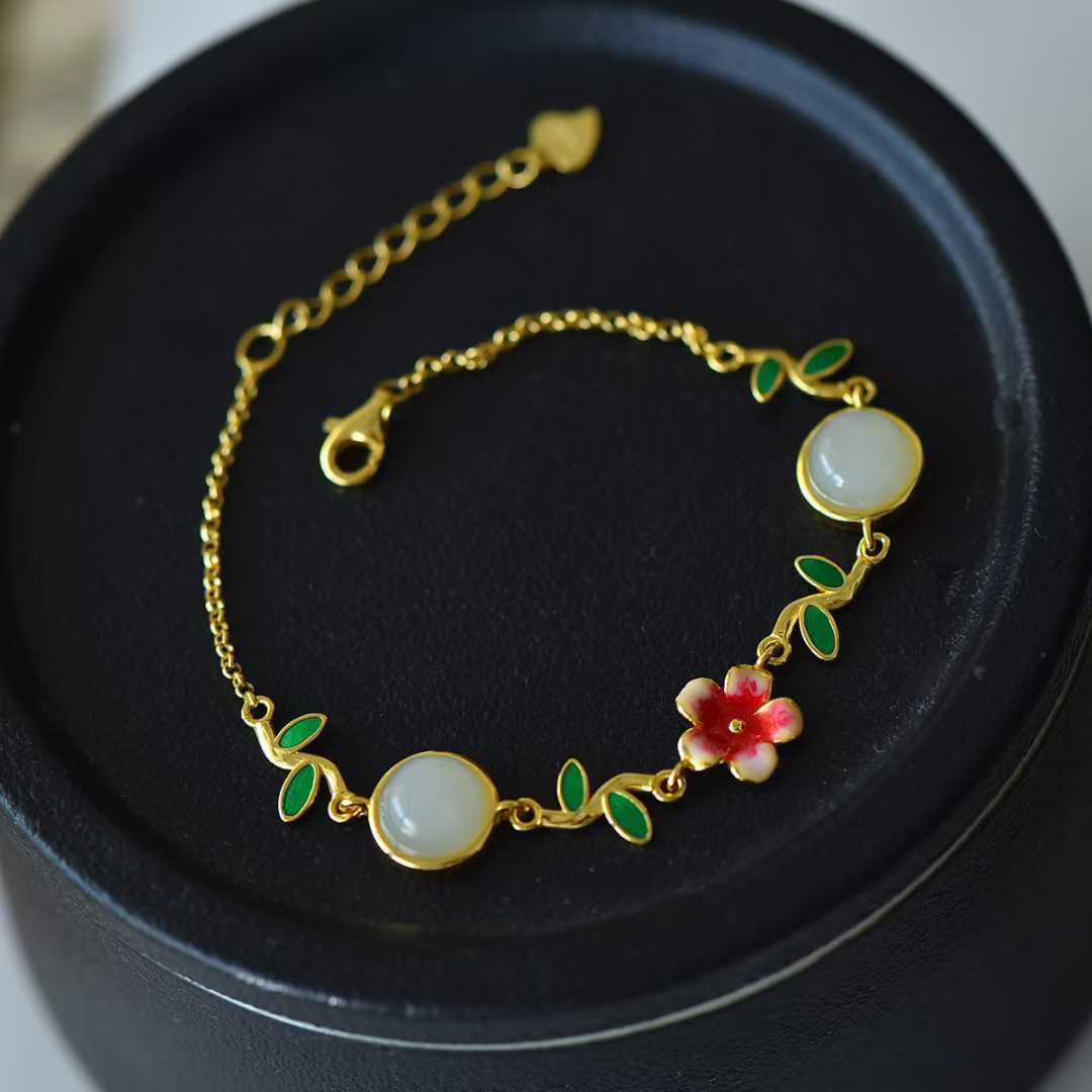 Close-up view of premium Hetian nephrite peach blossom pendant in S925 silver setting