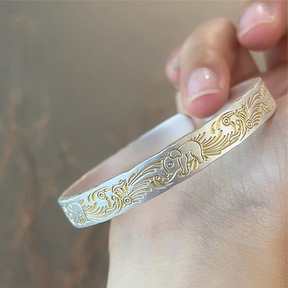 Solid bracelet with gold - painted lucky elephant and hammered pattern - jewelry - weilin.com