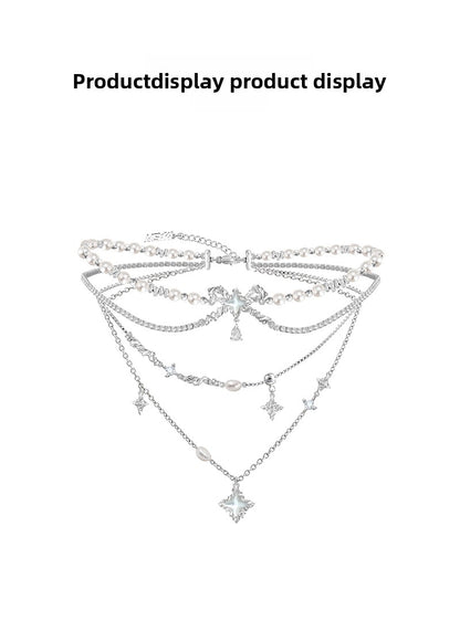 Layered pearl necklace with star pendant